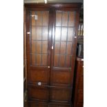 Oak 4-door bookcase with leaded glazed doors