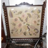 Woolwork firescreen in oak frame with barley-twist supports