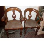 Pair of Victorian mahogany scroll arm pub chairs