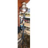 Wrought iron oil lamp stand with copper reservoir and a brass tray