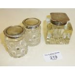 Three cut-glass inkwells with hallmarked silver tops