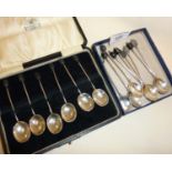 Cased set of six Art Deco Sterling silver coffee spoons with bean finials, together with another