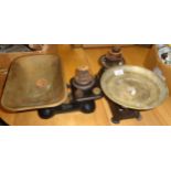 Two kitchen scales with brass pans and weights