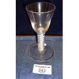A short 18th c. wine glass with bowl on air twist stem and folded foot, height 11cm