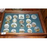 Table top display case containing 19 Victorian glass souvenir paperweights