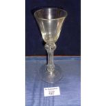 18th c. wine glass with bell bowl on knopped and ribbed stem enclosing elongated air tear on conical