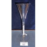 A wine flute with trumpet bowl tapering to air twist stem (scratched), c18th c, height 18cm