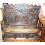 18th c. carved oak settle, approx. 134cm wide x 140cm high