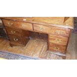 Edwardian mahogany kneehole desk with six drawers