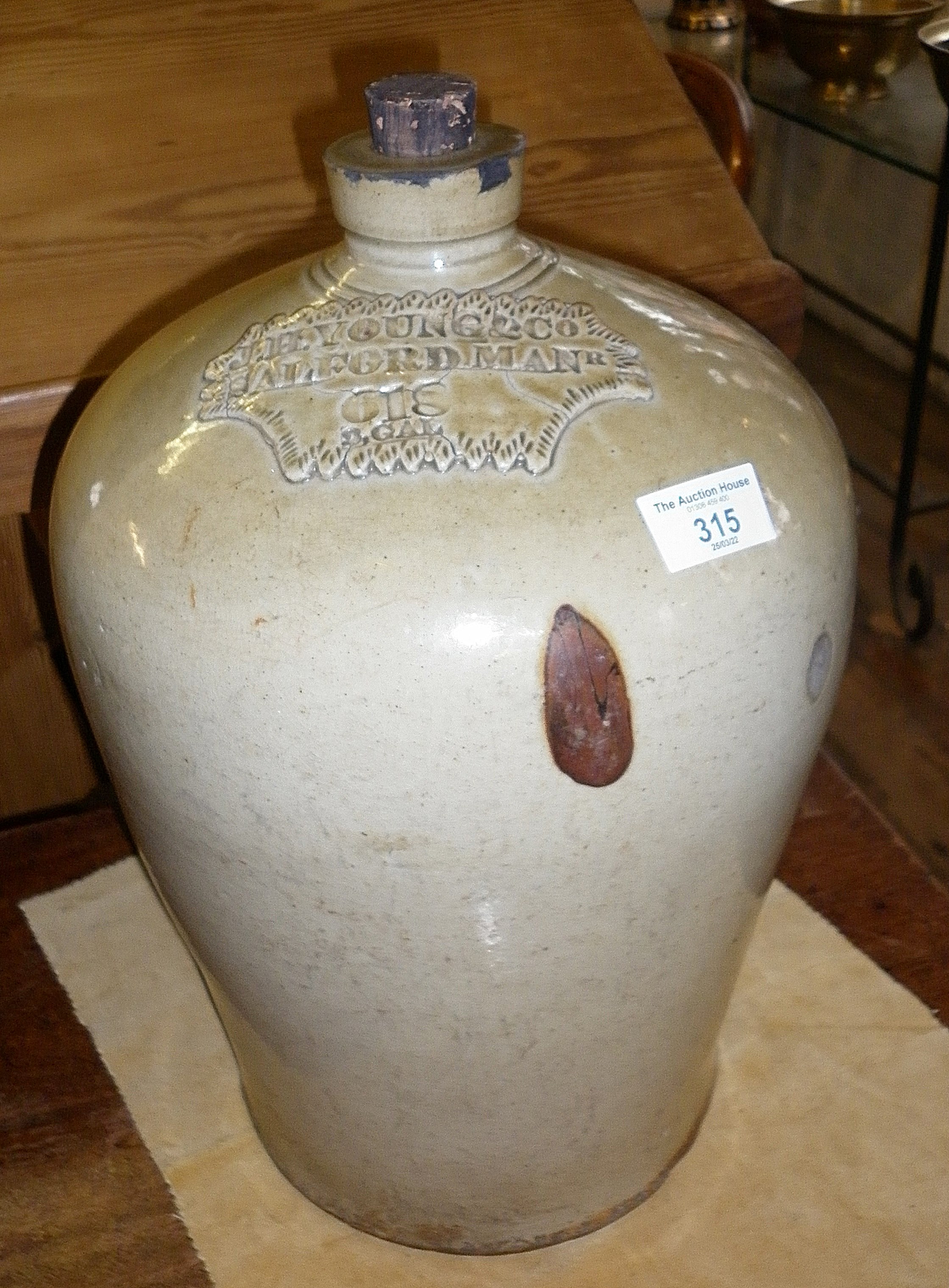 Large stoneware flagon with impressed legend, "J.H. YOUNG & CO. SALFORD MANR, 618 2GAL", c. 1850's