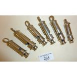 Good collection of old whistles (6) including Police Metropolitan, Scout and rare Girl Guides,