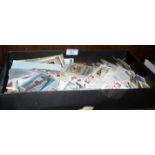 Tray of cigarette cards and postcards