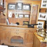 Pine kitchen dresser with upper section of shelves and glass fronted cabinet above four drawers