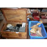 Wooden chest containing antique scales, old mechanical calculator, alarm clock and box of wooden
