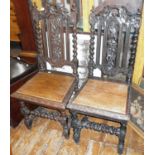 19th c. Black Forest ornately carved pair of hall chairs