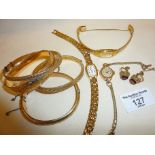 Rolled gold hinged bangles, wrist watches and pair of earrings