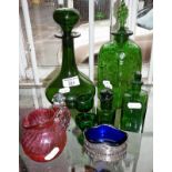 Antique green glass decanters, bottles, eyebaths etc.