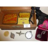 Old tins, WW2 paratrooper badge, silver West Yorkshire Regiment locket, silver cricket fob medal,