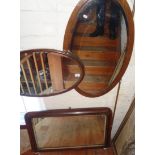 Two oval wall mirrors and an inlaid walnut overmantle mirror