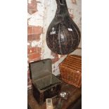 A McGurk hanging leather punch bag, an old tin and contents, a WW2 Army cycle lamp and others