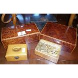 Two cross-banded burr walnut cigarette boxes, a Mauchline Ware box and two others