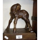 A bronze figure of a baby goat on plinth incised mark for Raymond de Meester, 24cm tall