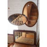 Two oval wall mirrors and an inlaid walnut overmantle mirror