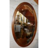 Oval inlaid mahogany wall mirror