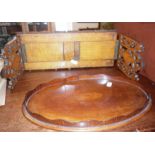 Victorian Gothic oak sliding bookrack and a small inlaid mahogany oval tray