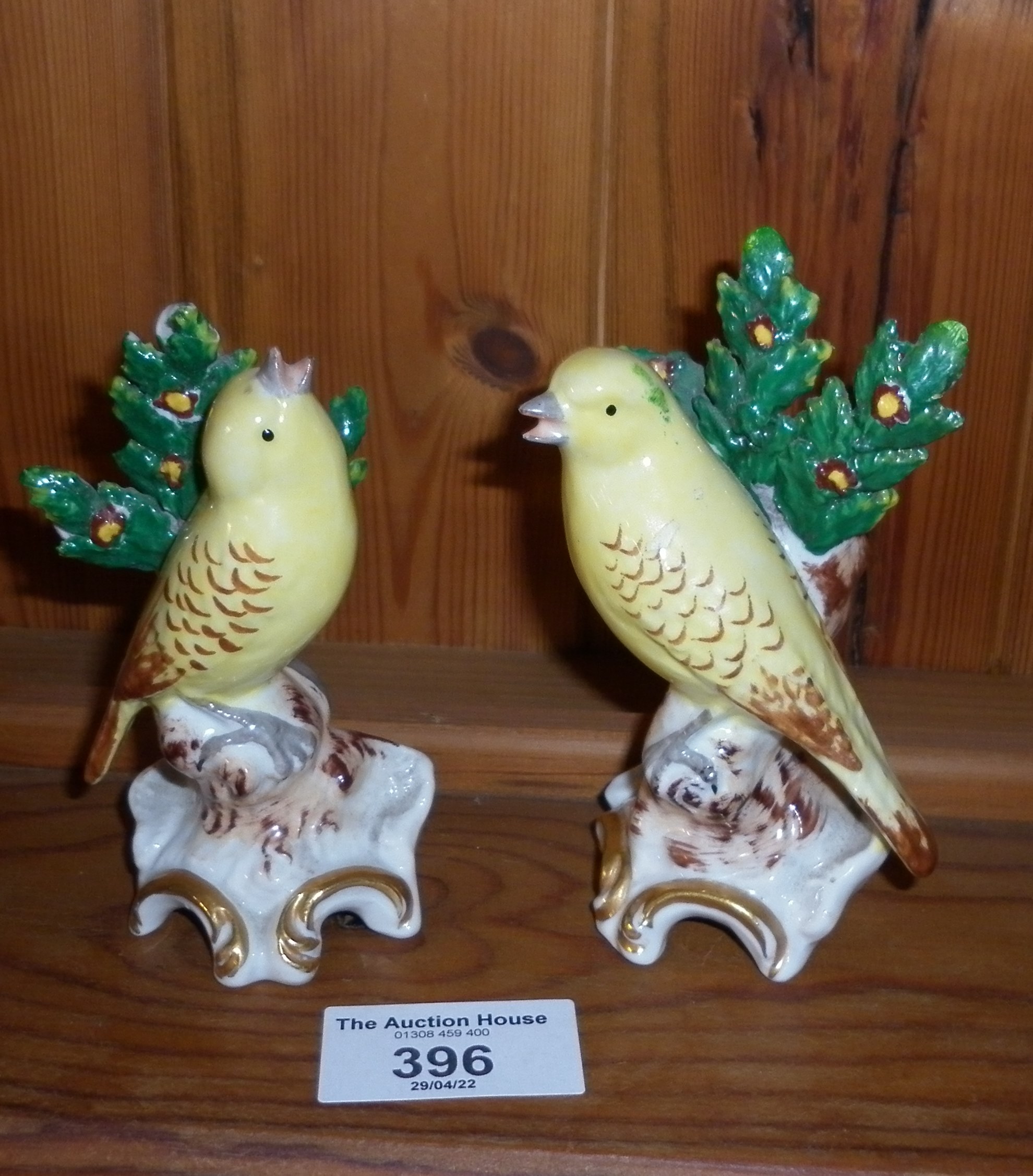 Pair of porcelain yellow canaries with gold anchor marks