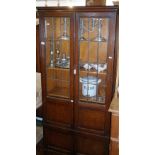 Oak four door bookcase with leaded glazed doors