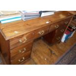 19th c. mahogany kneehole 5-drawer desk with inset cupboard below standing on bracket feet