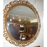 Round wall mirror with gilded frame