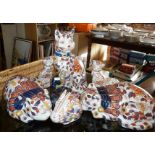 Group of modern Chinese Imari porcelain cat figures and a Japanese pottery fisherman figure (9)