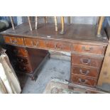 Mahogany kneehole desk of nine drawers