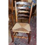 Set of 7 ladderback dining chairs with rush seats, inc. carver