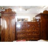 Regency flame mahogany wardrobe/compactum comprising 7 drawer chest of drawers flanked by two