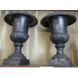 Pair of small cast iron urns, 7" high