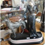Impressive Art Deco spelter figure of a lady and a dog on a three colourway marble base, 22" tall