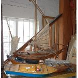 Scale wooden models of a Chinese sailing junk, a sampan and a wooden model of a Riva speedboat
