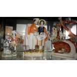 3 19th c. Staffordshire figural groups, inc. girl and soldier, pearlware boy and dog and a group