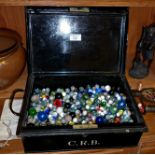 Large tin of assorted glass marbles