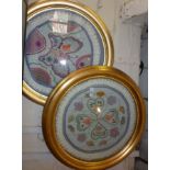 Pair gilt round frames enclosing embroidered fabric panels