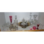 Small crystal glass ship's decanter with silver rim, a coaster, three other decanters and glassware,