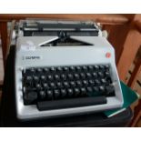 Olympia SM typewriter with case and booklet