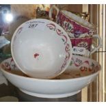 Early English porcelain tea bowl with saucer and pair of similar armorial tea cups