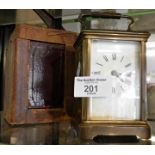 19th c. brass carriage clock with leather case (good working order)