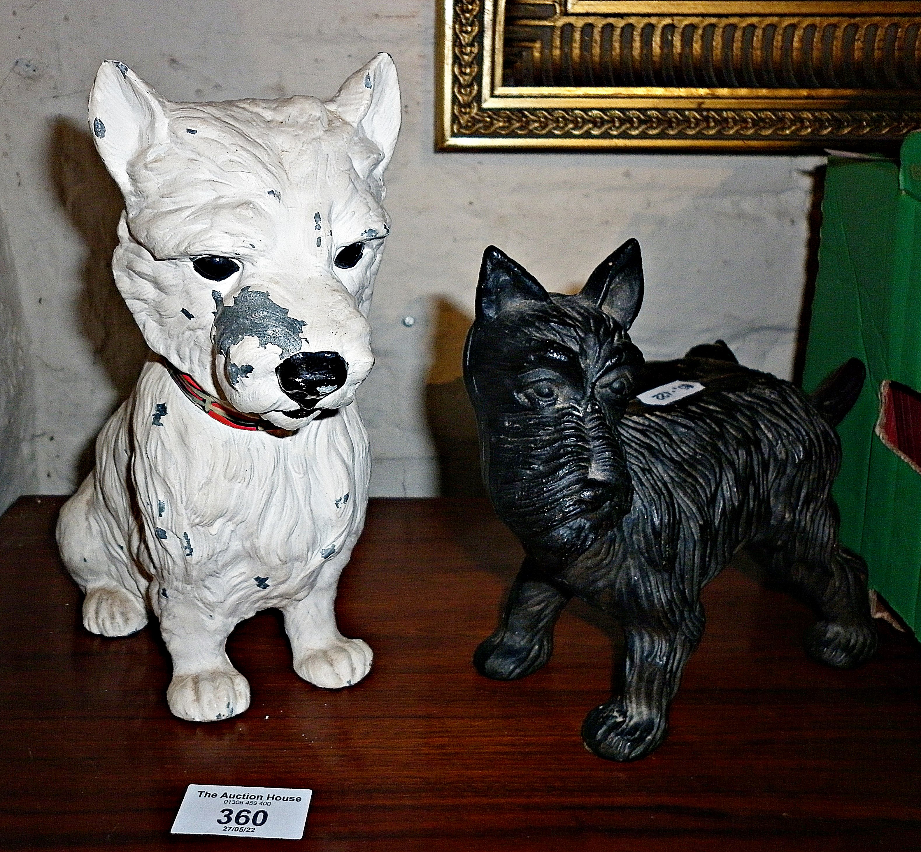 Painted spelter Scottie dog and an iron figure of a terrier with his leg cocked