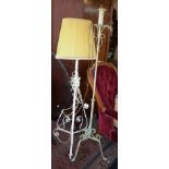 Two decorative wrought iron standard lamps with shades