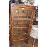 Oak cupboard with single glazed door